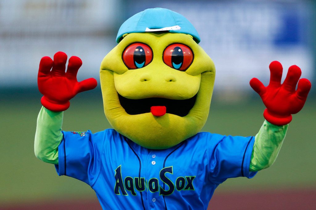 Webbly emerges from the stands during the season opener against the Eugene Emeralds on Friday, April 7, 2023, at Funko Field in Everett, Washington. (Ryan Berry / The Herald)