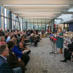 Lynn Deeken, the Dean of Arts, Learning Resources & Pathways at EvCC, addresses a large gathering during the ribbon cutting ceremony of the new Cascade Learning Center on Thursday, Sept. 28, 2023, at Everett Community College in Everett, Washington. (Ryan Berry / The Herald)