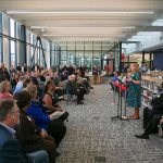 Lynn Deeken, the Dean of Arts, Learning Resources & Pathways at EvCC, addresses a large gathering during the ribbon cutting ceremony of the new Cascade Learning Center on Thursday, Sept. 28, 2023, at Everett Community College in Everett, Washington. (Ryan Berry / The Herald)