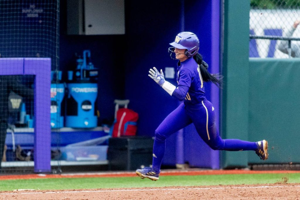 Washingtons Sami Reynolds rounds third on her way to scoring a run during an NCAA Tournament game against McNeese State on May 19, 2023, in Seattle. (Scott Eklund / Red Box Pictures)