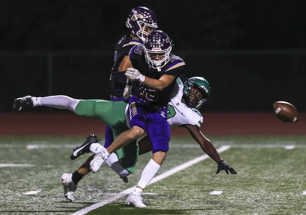 Players fight for the ball during a football game between Lake Stevens and West Linn at Lake Stevens High School in Lake Stevens, Washington on Friday, Sept. 22, 2023. West Linn won, 49-30. (Annie Barker / The Herald)
