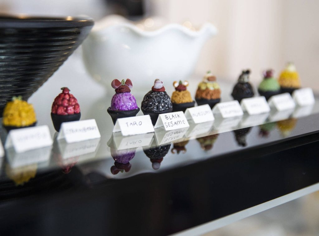 Tiny figurines embody the many flavor options at Our Place Dessert Cafe on Wednesday, Sept. 27, 2023 in Edmonds, Washington. (Olivia Vanni / The Herald)