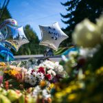 A memorial for a 15-year-old shot and killed last week is set up at a bus stop along Harrison Road on Wednesday, Sept. 13, 2023, in Everett, Washington. (Ryan Berry / The Herald)