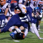 Sultan’s Derek Feltner tries to stay upright after picking up an offensive fumble and getting a few yards against Granite Falls on Friday, Sep. 30, 2022, at Sultan High School in Sultan, Washington. (Ryan Berry / The Herald)