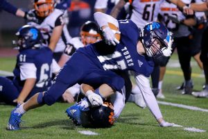 Sultan’s Derek Feltner tries to stay upright after picking up an offensive fumble and getting a few yards against Granite Falls on Friday, Sep. 30, 2022, at Sultan High School in Sultan, Washington. (Ryan Berry / The Herald)