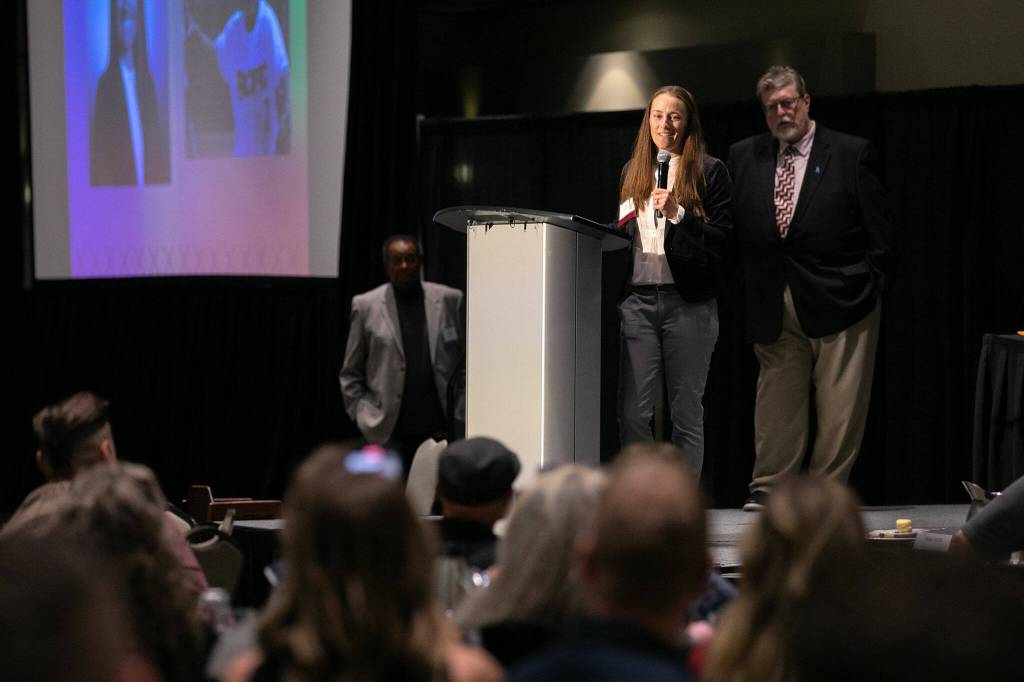 Hall of Fame inductee Gina Carbonnato accepts her award during the 2023 Snohomish County Sports Hall of Fame Banquet on Wednesday, Sept. 27, 2023, at Angel of the Winds Arena in Everett, Washington. (Ryan Berry / The Herald)