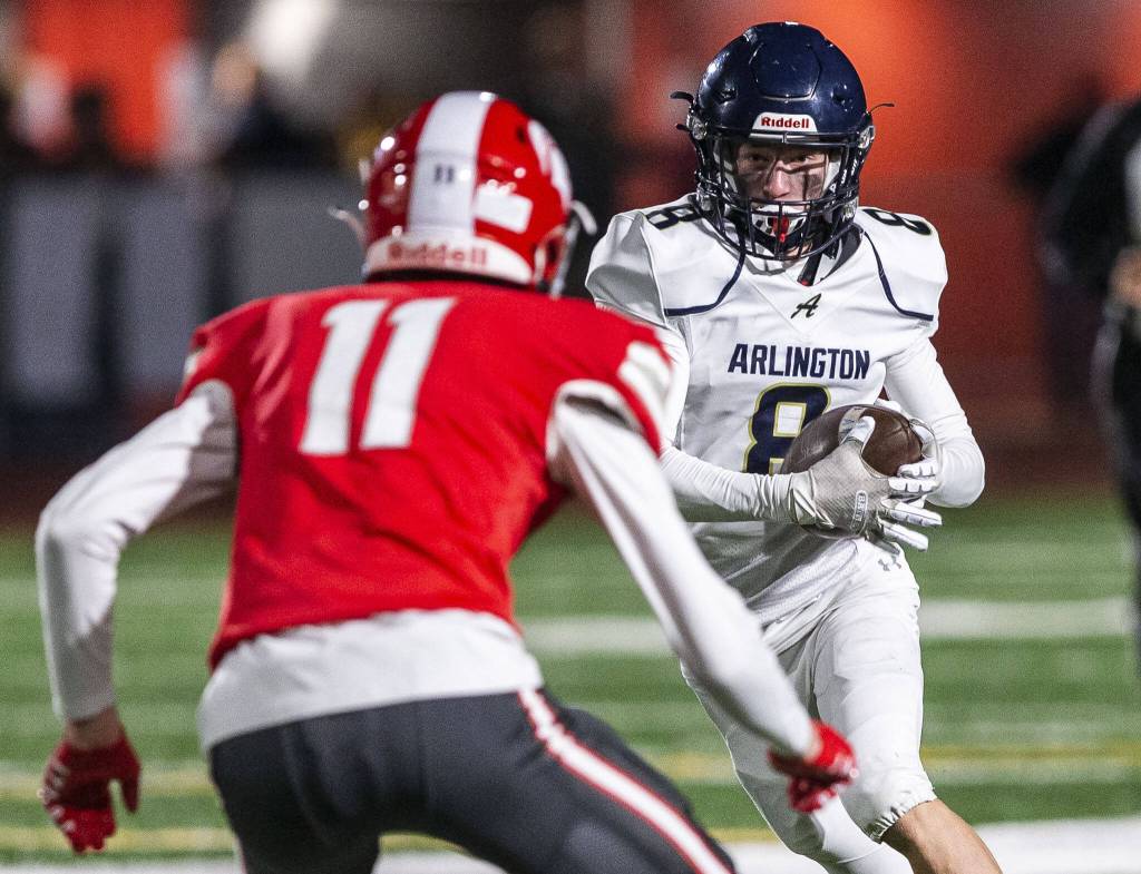 Arlingtons Kaid Hunter runs the ball during the game against Stanwood on Friday, Sept. 29, 2023 in Stanwood, Washington. (Olivia Vanni / The Herald)