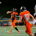 Monroe senior quarterback Blake Springer slings a first half touchdown against Mountlake Terrace on Friday, Sept. 29, 2023, at Monroe High School in Monroe, Washington. (Ryan Berry / The Herald)