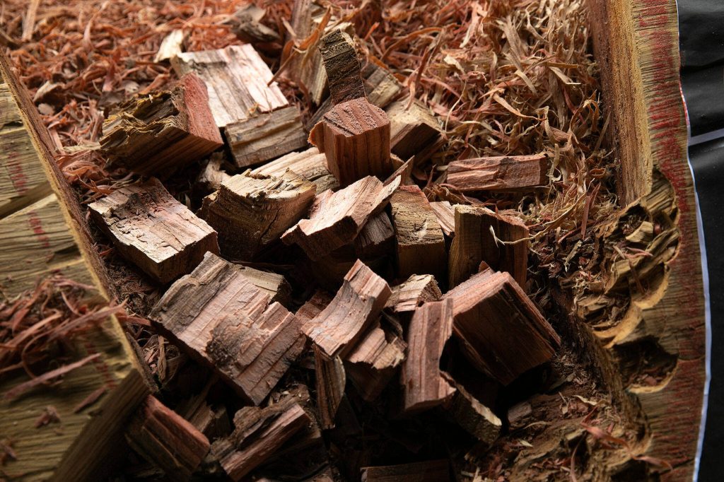 Fist-sized pieces of wood collect on top of Archbishop Murphys healing pole. (Ryan Berry / The Herald)