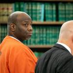 Antonial Monroe, left, alongside defense attorney Donald Wackerman, center, looks over at prosecuting attorney Matt Hunter as Hunter addresses the court during Monroe's sentencing hearing Thursday, Oct. 5, 2023, at Snohomish County Superior Court in Everett, Washington. (Ryan Berry / The Herald)