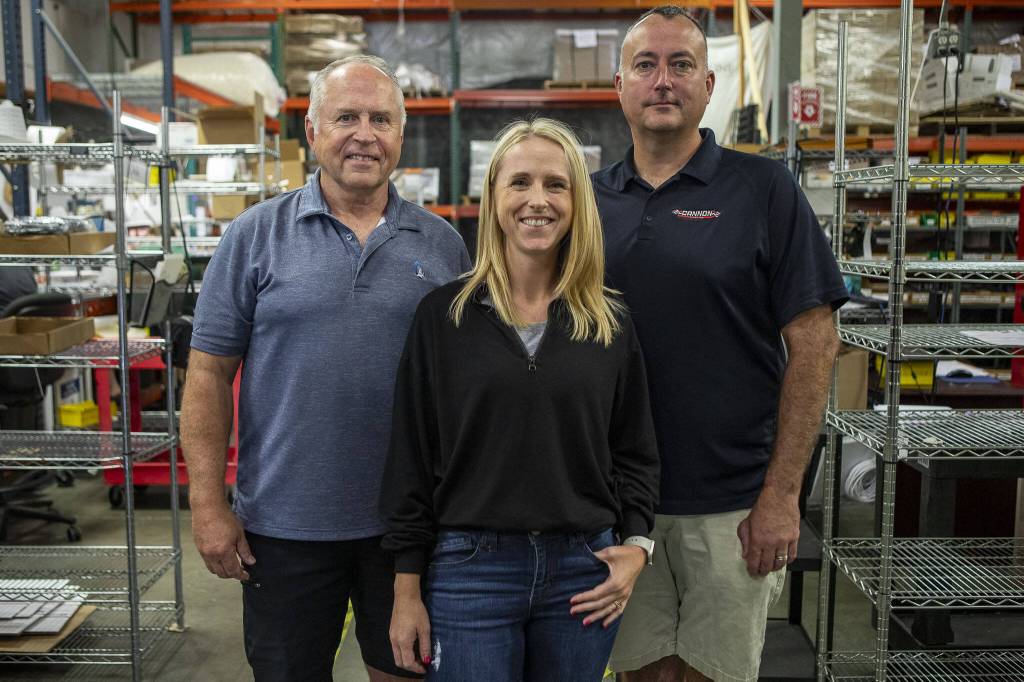 Left to right, president Bill Peterson, vice president Jamie Gamez, and executive vice president Jeff Cannon pose for a photo at Morris Magnets in Monroe, Washington on Wednesday, Sept. 13, 2023. (Annie Barker / The Herald)