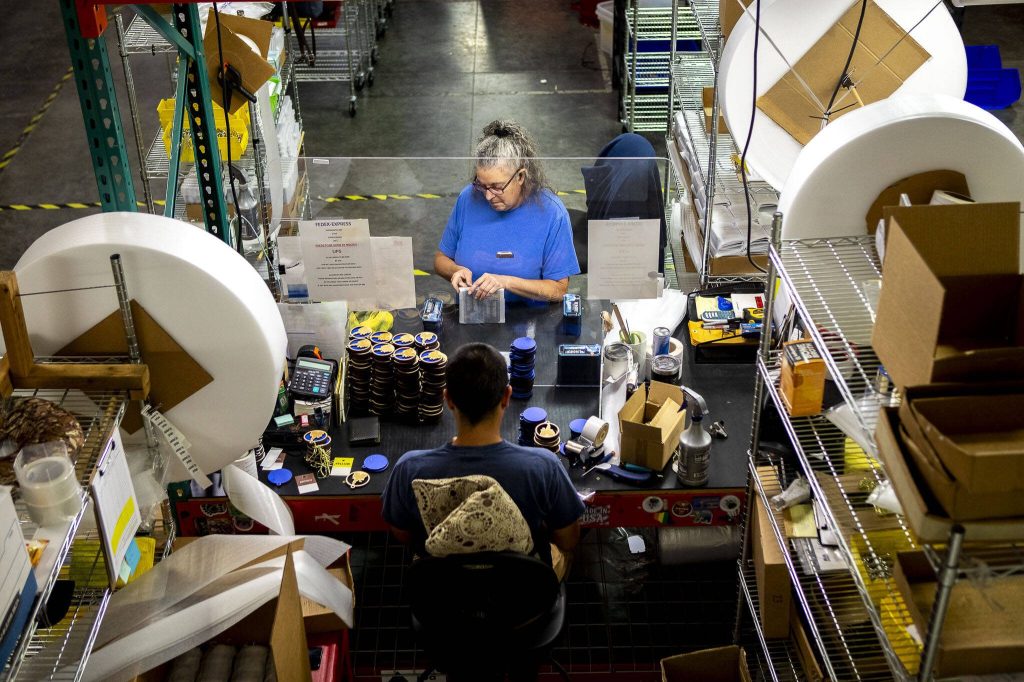 Susan Pearson prepares magnets for shipping at Morris Magnets in Monroe, Washington on Wednesday, Sept. 13, 2023. (Annie Barker / The Herald)