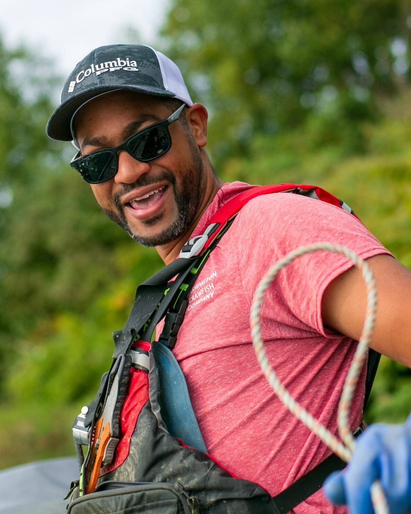 Ithamar Glumac laughs while telling a fishermans tale as he zooms up and down the Snohomish River in his boat Tuesday, Sept. 19, 2023, near Snohomish, Washington. (Ryan Berry / The Herald)