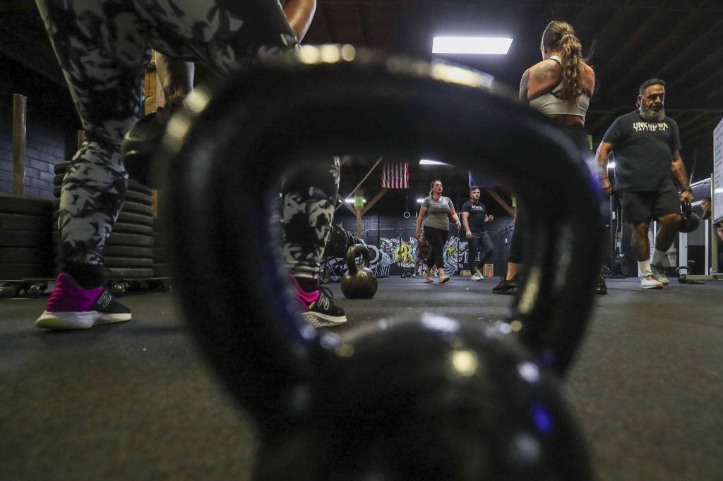 Participants complete training exercises during a class lead by Harrison Wolff at Remedy Athletics in Marysville, Washington on Wednesday, Oct. 11, 2023. (Annie Barker / The Herald)
