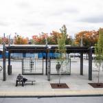 People wait for different busses at the Lynnwood Transit Center on Wednesday, Oct. 4, 2023 in Lynnwood, Washington. (Olivia Vanni / The Herald)