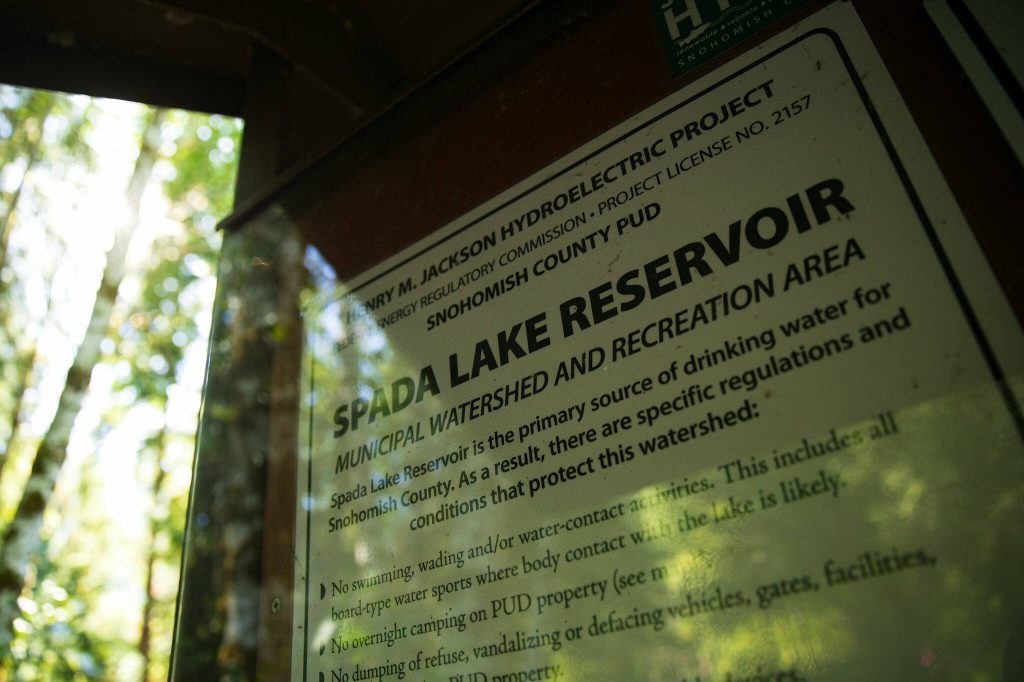 Signs around Spada Lake inform the public of the reservoirs role as a water supply for Snohomish County on Sunday, Oct. 1, 2023, near Sultan, Washington. (Ryan Berry / The Herald)