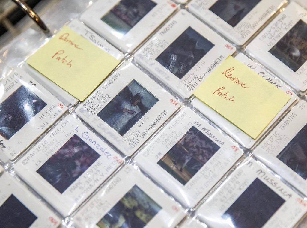 Film photo slides of different baseball players Mike Cramer saved. (Olivia Vanni / The Herald)