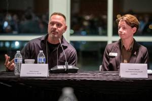 Snohomish County Sheriff candidates Adam Fortney Susanna Johnson during an Everett Council of Neighborhoods forum on Monday, Oct. 16, 2023 in Everett, Washington. (Olivia Vanni / The Herald)