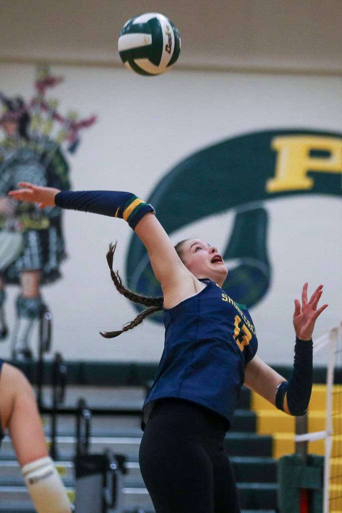 Shorecrests Emmeline Koenig (13) hits the ball during a volleyball game between Lynnwood and Shorecrest at Shorecrest High School in Shoreline, Washington on Tuesday, Oct. 3, 2023. Lynnwood took the win. (Annie Barker / The Herald)