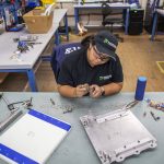 Dominique Gonzalez works at Pathfinder Manufacturing on Tuesday, Oct. 10, 2023 in Everett, Washington. (Olivia Vanni / The Herald)