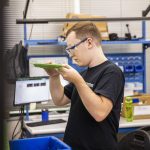 Michael Tamte works at Pathfinder Manufacturing on Tuesday, Oct. 10, 2023 in Everett, Washington. (Olivia Vanni / The Herald)