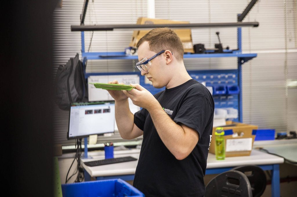 Michael Tamte works at Pathfinder Manufacturing on Tuesday, Oct. 10, 2023 in Everett, Washington. (Olivia Vanni / The Herald)