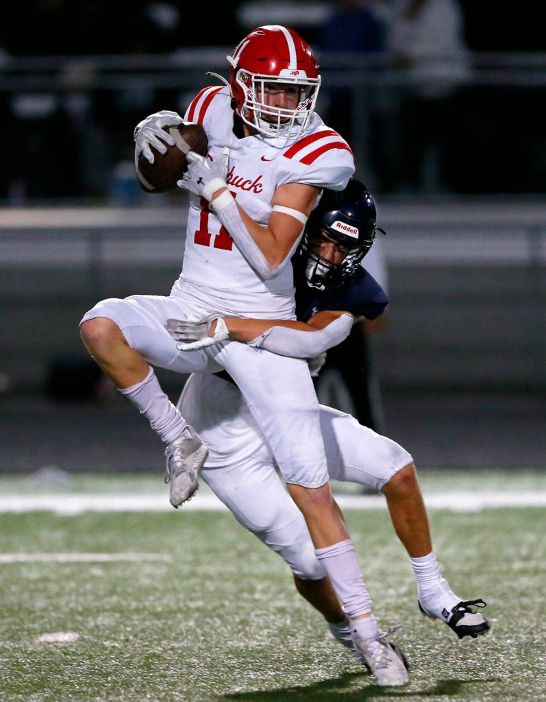 Marysville Pilchucks Shane Nelson comes down with a catch over the middle against Arlington on Friday, Oct. 6, 2023, at Arlington High School in Arlington, Washington. (Ryan Berry / The Herald)