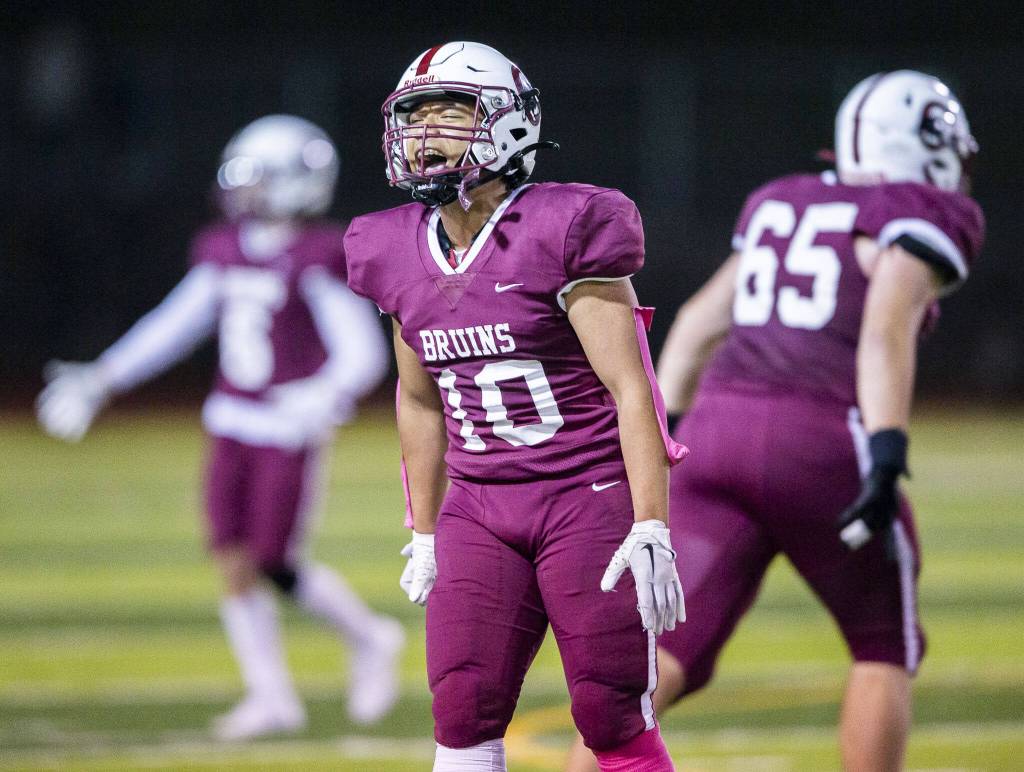 Cascades Devyn Chan cheers after the defense gets a stop during the game against Everett on Friday, Oct. 6, 2023 in Everett, Washington. (Olivia Vanni / The Herald)