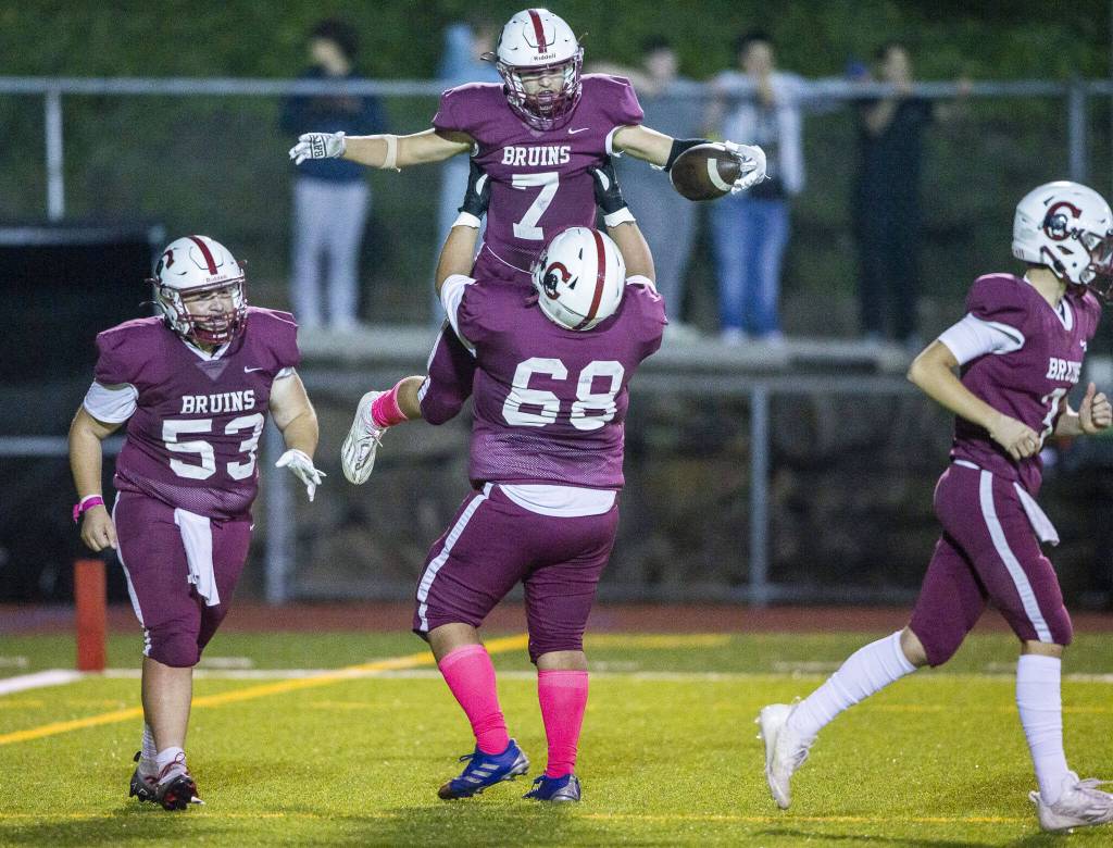Cascades Placido Del Moral lifts Cascades Zachary Lopez into the air in celebration during the game against Everett on Friday, Oct. 6, 2023 in Everett, Washington. (Olivia Vanni / The Herald)