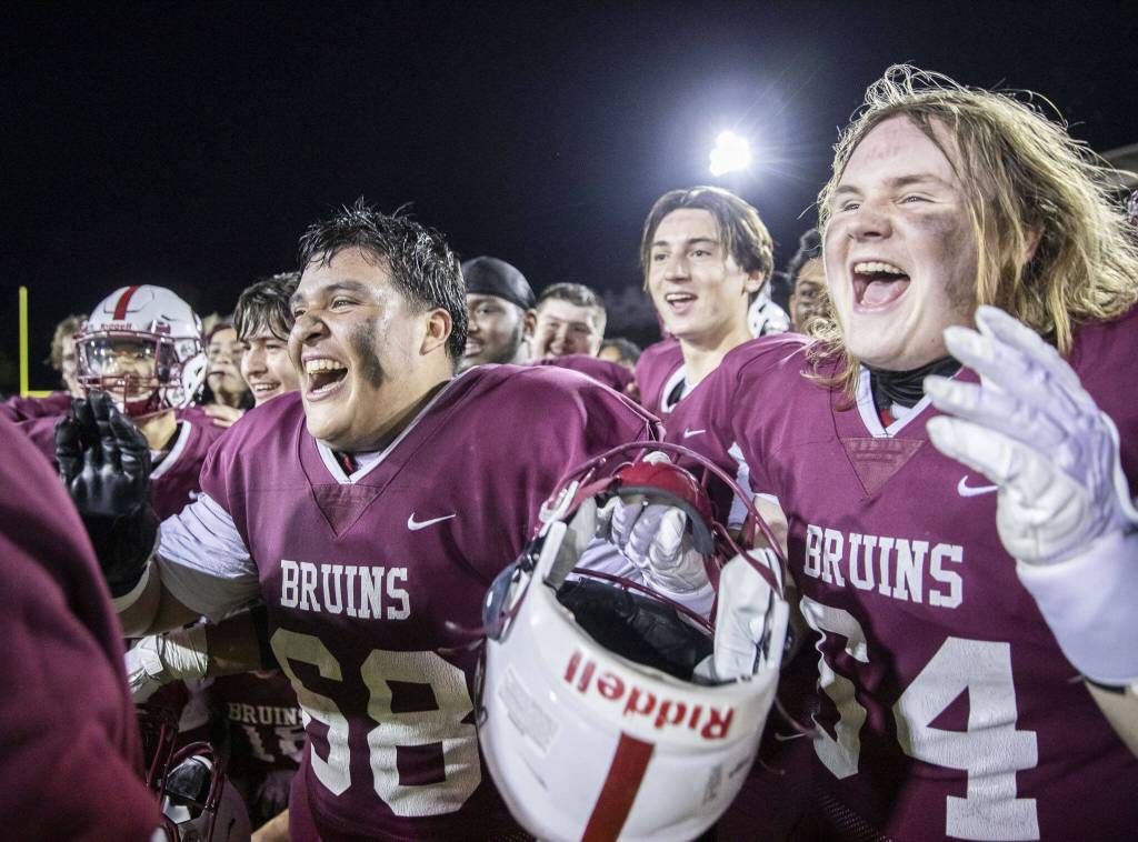 Cascades Placido Del Moral and William Nelson cheer as their team is presented with a trophy on Friday, Oct. 6, 2023 in Everett, Washington. (Olivia Vanni / The Herald)