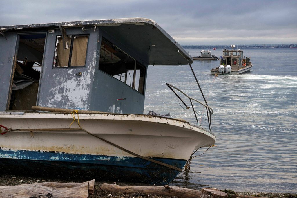 On Oct.3, 2023, an abandoned boat was towed from the Clinton shore. (Photo by David Welton)