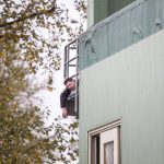 A dead person is visible on a balcony of a building during a mass casualty training on Wednesday, Oct. 11, 2023 in Snohomish, Washington. (Olivia Vanni / The Herald)
