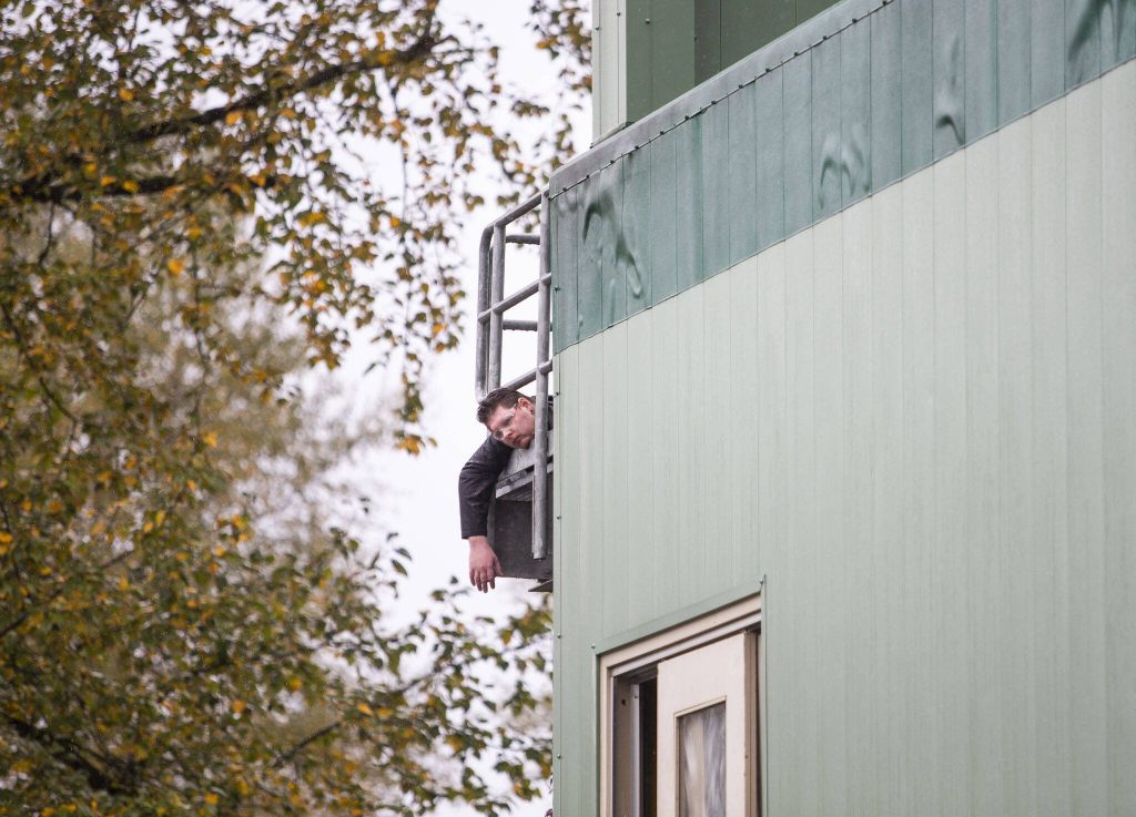 A dead person is visible on a balcony of a building during a mass casualty training on Wednesday, Oct. 11, 2023 in Snohomish, Washington. (Olivia Vanni / The Herald)