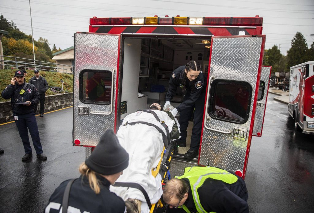 A victim is loaded into an ambulance for transport to a hospital during a mass casualty training on Wednesday, Oct. 11, 2023 in Snohomish, Washington. (Olivia Vanni / The Herald)