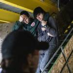 Two wounded victims make their way down a flight of stairs while being directed by Everett SWAT during a mass casualty training on Wednesday, Oct. 11, 2023 in Snohomish, Washington. (Olivia Vanni / The Herald)
