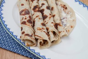 Traditional Norwegian holiday lefse rolled on a plate