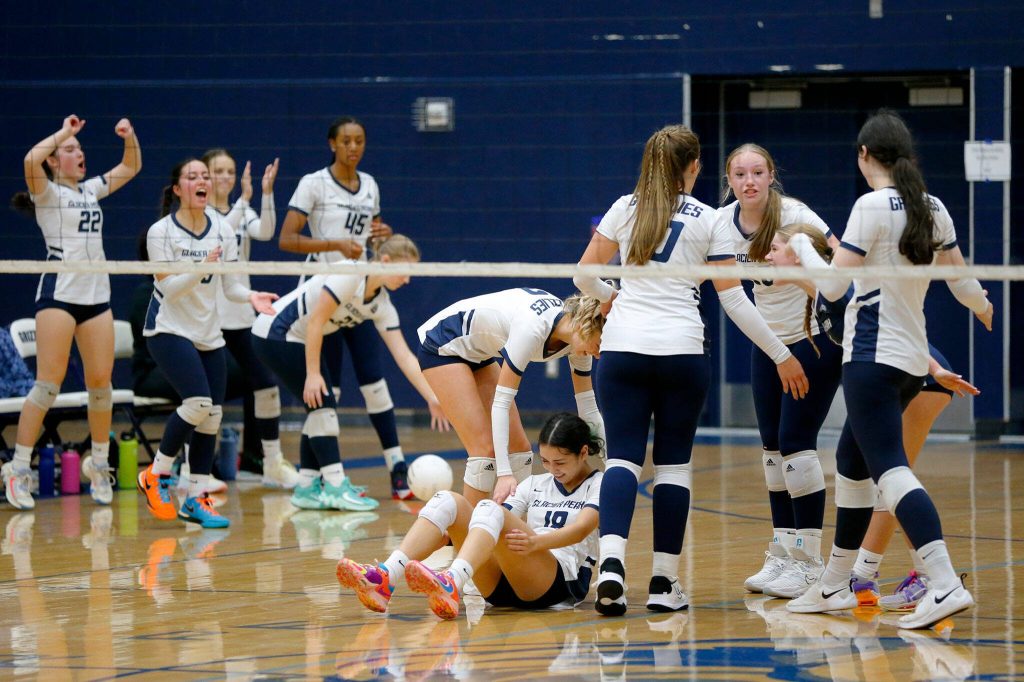 Glacier Peak players celebrate a point against Lake Stevens on Tuesday, Oct. 10, 2023, at Glacier Peak High School in Snohomish, Washington. (Ryan Berry / The Herald)