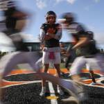 Senior quarterback Kaden LaPlaunt (8) poses for a portrait between practicing drills at Granite Falls High School in Grantie Falls, Washington on Wednesday, Oct. 11, 2023. (Annie Barker / The Herald)