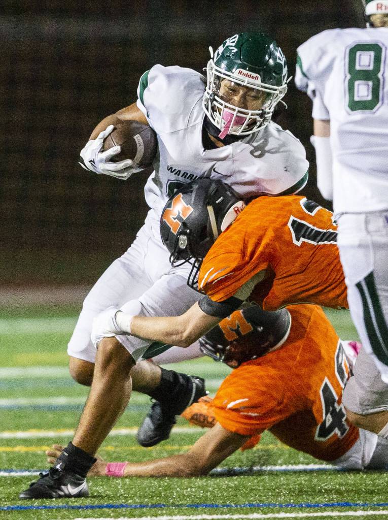 Edmonds-Woodways Jesse Hart is tackled during the game against Monroe on Friday, Oct. 13, 2023 in Monroe, Washington. (Olivia Vanni / The Herald)