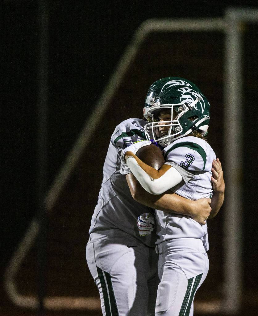 Edmonds-Woodways Cannon Kennard celebrates his touchdown during the game against Monroe on Friday, Oct. 13, 2023 in Monroe, Washington. (Olivia Vanni / The Herald)