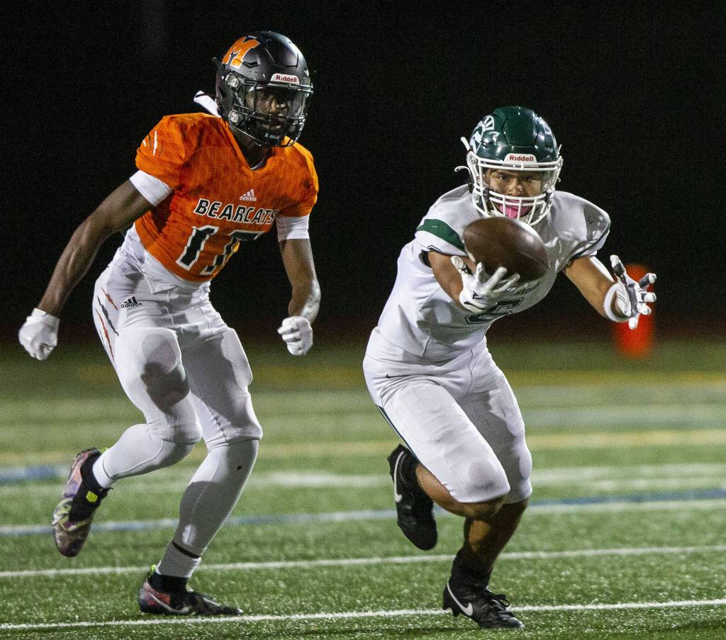 Edmonds-Woodways Jesse Hart reaches out to try and catch a pass that bounced off his helmet during the game against Monroe on Friday, Oct. 13, 2023 in Monroe, Washington. (Olivia Vanni / The Herald)