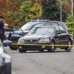 Police survey a scene where a victim was found in a vehicle with bullet holes in the passenger side of the windshield along East Casino Road on Friday, Oct. 13, 2023 in Everett, Washington. (Olivia Vanni / The Herald)