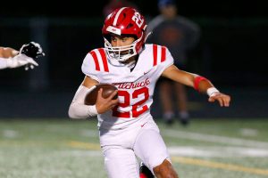 Marysville Pilchuck junior running back Joseph Davis takes a handoff for a big gain against Arlington on Friday, Oct. 6, 2023, at Arlington High School in Arlington, Washington. (Ryan Berry / The Herald)