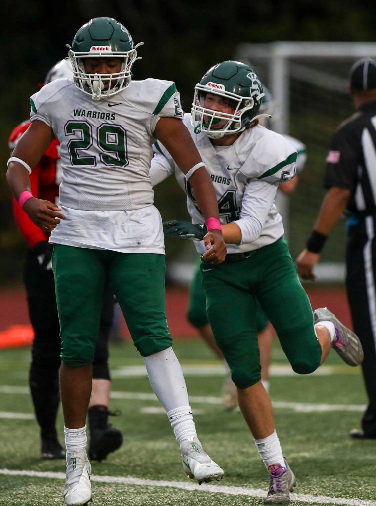 Edmonds-Woodways Rashaad Gerona-Chatters (29) reacts to scoring during a game between Edmonds-Woodway and Mountlake Terrace at Edmonds-Woodway Stadium in Edmonds, Washington on Friday, Oct. 20, 2023. Edmonds-Woodway won, 13-10. (Annie Barker / The Herald)