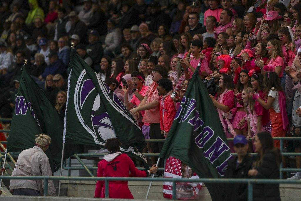 Fans cheer during a game between Edmonds-Woodway and Mountlake Terrace at Edmonds-Woodway Stadium in Edmonds, Washington on Friday, Oct. 20, 2023. Edmonds-Woodway won, 13-10. (Annie Barker / The Herald)