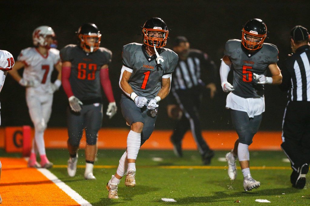 Granite Falls captain Johnathan Roberts celebrates his toe-tap touchdown reception against Kings on Friday, Oct. 20, 2023, at Granite Falls High School in Granite Falls, Washington. (Ryan Berry / The Herald)