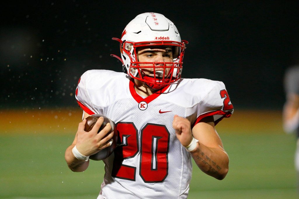 Kings running back Braeden Caulk looks at open space while running against Granite Falls on Friday, Oct. 20, 2023, at Granite Falls High School in Granite Falls, Washington. (Ryan Berry / The Herald)