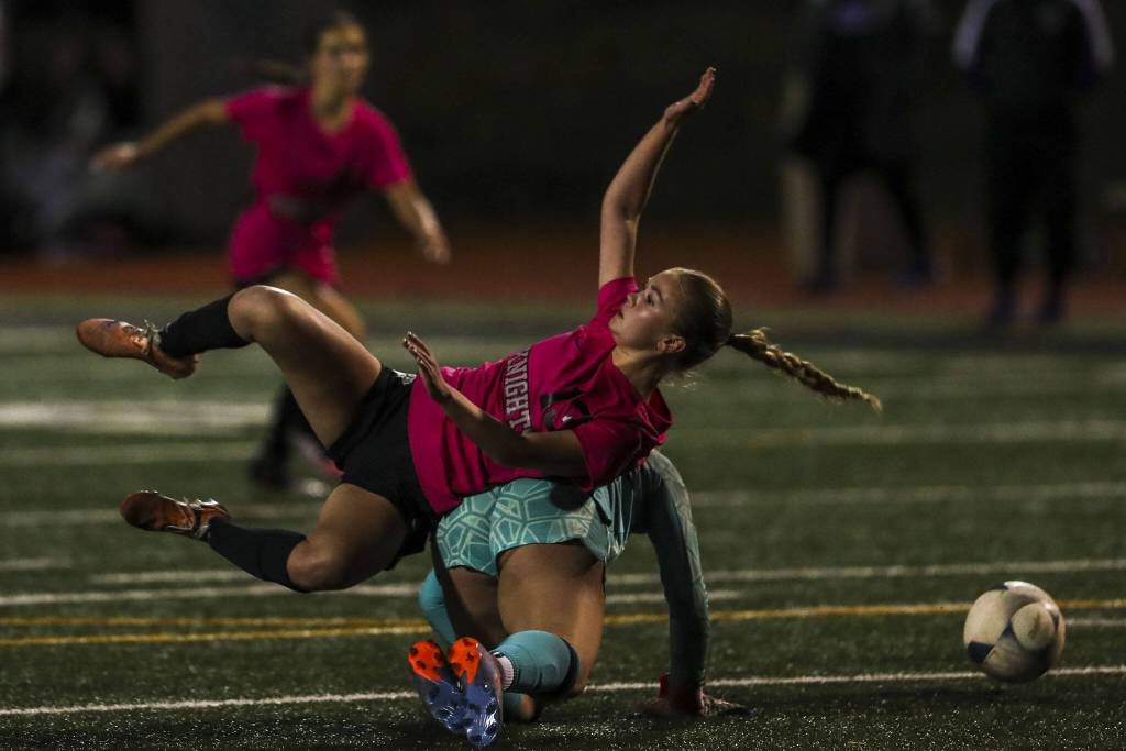 Kamiaks Alyia Johnson (13) rolls over another player during a game between Lake Stevens and Kamiak at Kamiak High School in Mukilteo, Washington on Monday, Oct. 23, 2023. Lake Stevens won, 4-2. (Annie Barker / The Herald)