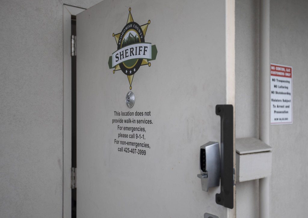 The door to the Mariner Square Station directs people to different phone numbers to call for assistance on Tuesday, Oct. 24, 2023 in Everett, Washington. (Olivia Vanni / The Herald)