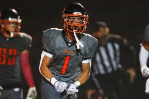 Granite Falls captain Johnathan Roberts celebrates his toe-tap touchdown reception against Kings on Friday, Oct. 19, 2023, at Granite Falls High School in Granite Falls, Washington. (Ryan Berry / The Herald)